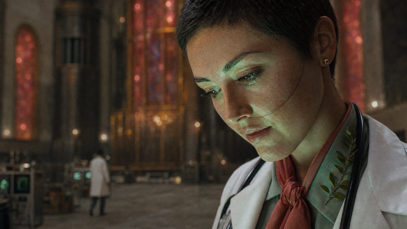 A doctor looks down, her face lit green by the coin.